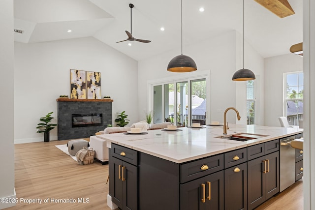 4522 Majestic Hills Loop, Brooksville, FL 34601 - kitchen featuring healthy amount of natural light, a ceiling fan, light wood-type flooring, recessed lighting, and high vaulted ceiling