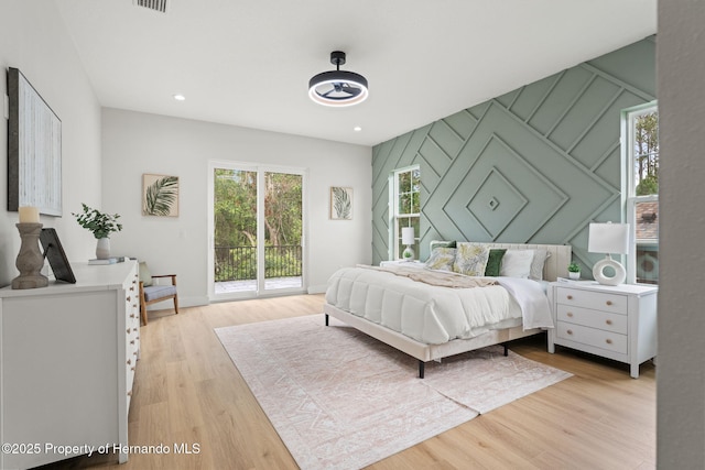 4522 Majestic Hills Loop, Brooksville, FL 34601 - bedroom featuring access to exterior, light wood-type flooring, and recessed lighting