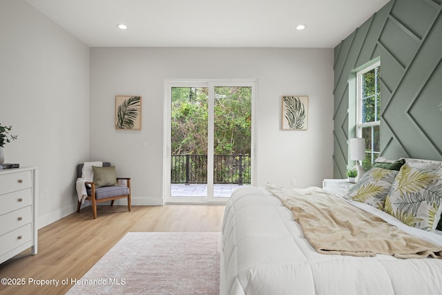 4522 Majestic Hills Loop, Brooksville, FL 34601 - bedroom featuring access to exterior, multiple windows, light wood finished floors, and recessed lighting