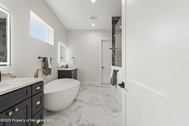 4522 Majestic Hills Loop, Brooksville, FL 34601 - bathroom featuring marble finish flooring, two vanities, a freestanding bath, recessed lighting, and a shower