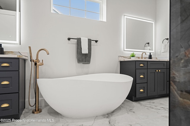 4522 Majestic Hills Loop, Brooksville, FL 34601 - bathroom with marble finish flooring, vanity, and a freestanding tub