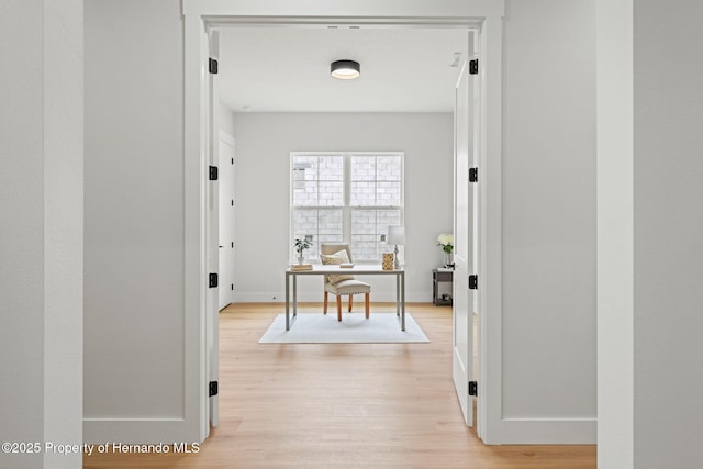 4522 Majestic Hills Loop, Brooksville, FL 34601 - corridor with light wood-style floors and an office area