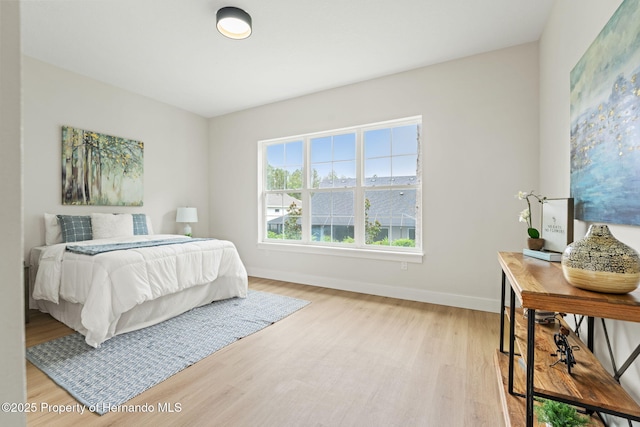 4522 Majestic Hills Loop, Brooksville, FL 34601 - bedroom with light wood-style floors and baseboards