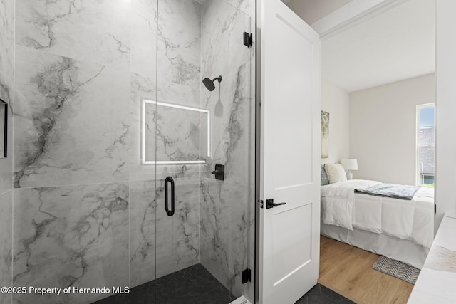 4522 Majestic Hills Loop, Brooksville, FL 34601 - ensuite bathroom with a marble finish shower and wood finished floors