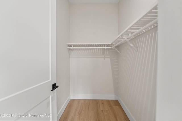 4522 Majestic Hills Loop, Brooksville, FL 34601 - spacious closet featuring wood finished floors