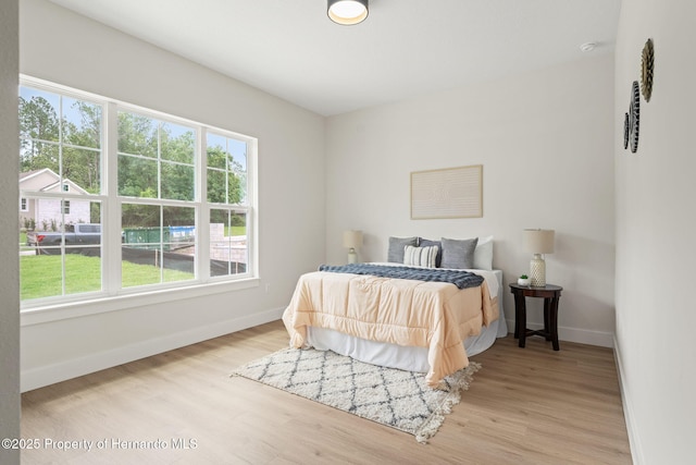 4522 Majestic Hills Loop, Brooksville, FL 34601 - bedroom with baseboards and wood finished floors