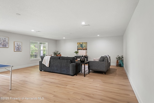 4522 Majestic Hills Loop, Brooksville, FL 34601 - living area with light wood finished floors and recessed lighting