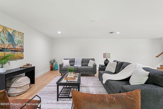 4522 Majestic Hills Loop, Brooksville, FL 34601 - living area featuring stairs, light wood-style floors, and recessed lighting