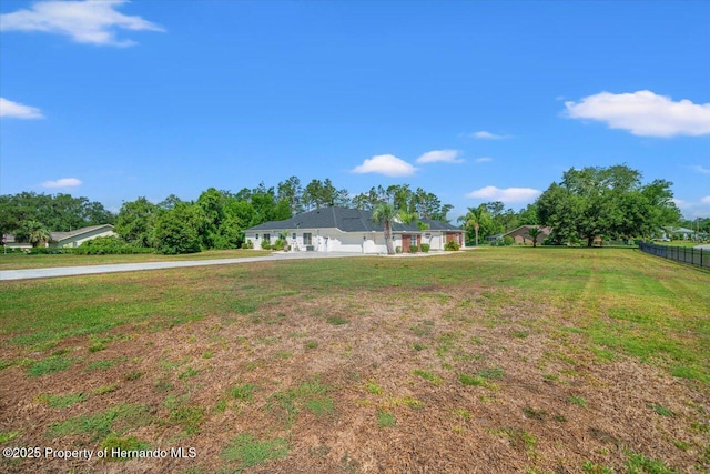 11137 Woodland Waters Blvd, Spring Hill, FL 34613 - view of yard featuring driveway