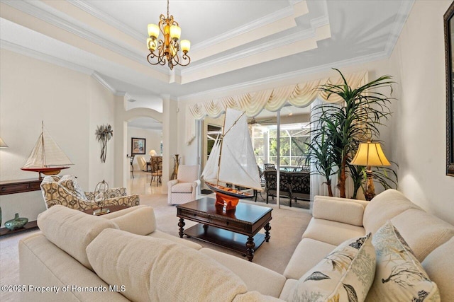11137 Woodland Waters Blvd, Spring Hill, FL 34613 - carpeted living area with arched walkways, crown molding, a chandelier, and a raised ceiling