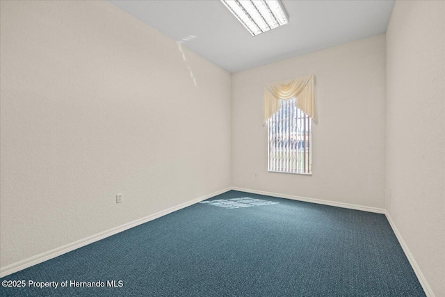11137 Woodland Waters Blvd, Spring Hill, FL 34613 - carpeted spare room featuring baseboards