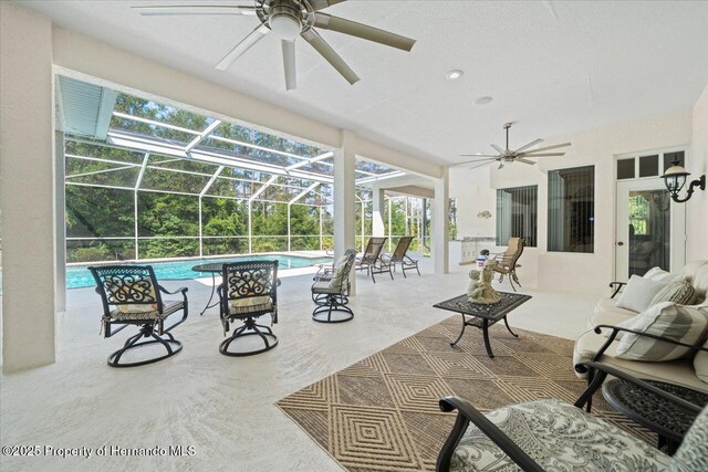 11137 Woodland Waters Blvd, Spring Hill, FL 34613 - view of patio featuring ceiling fan, an outdoor pool, and glass enclosure