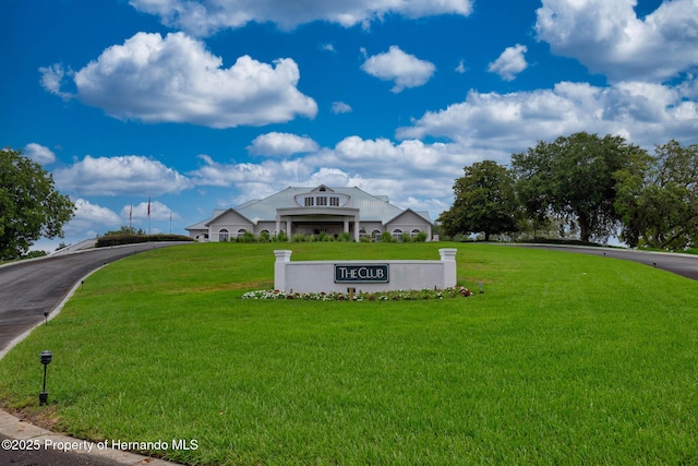 8308 Mobile Cir, Weeki Wachee, FL 34613 - view of home's community featuring a lawn and asphalt driveway