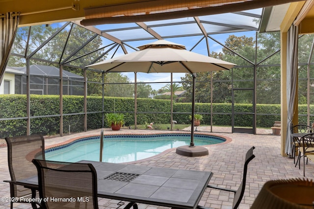 8308 Mobile Cir, Weeki Wachee, FL 34613 - view of pool featuring a patio area and glass enclosure