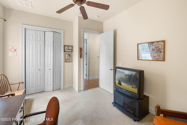 8308 Mobile Cir, Weeki Wachee, FL 34613 - bedroom featuring carpet, a closet, baseboards, a ceiling fan, and an office area