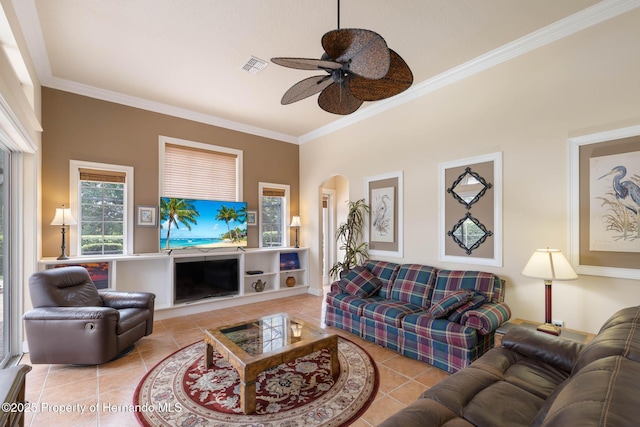 8308 Mobile Cir, Weeki Wachee, FL 34613 - living room featuring crown molding, tile patterned floors, arched walkways, and a ceiling fan