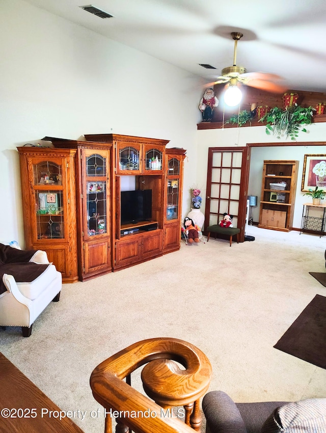 6208 Roble Ave, Spring Hill, FL 34608 - carpeted living area with a ceiling fan
