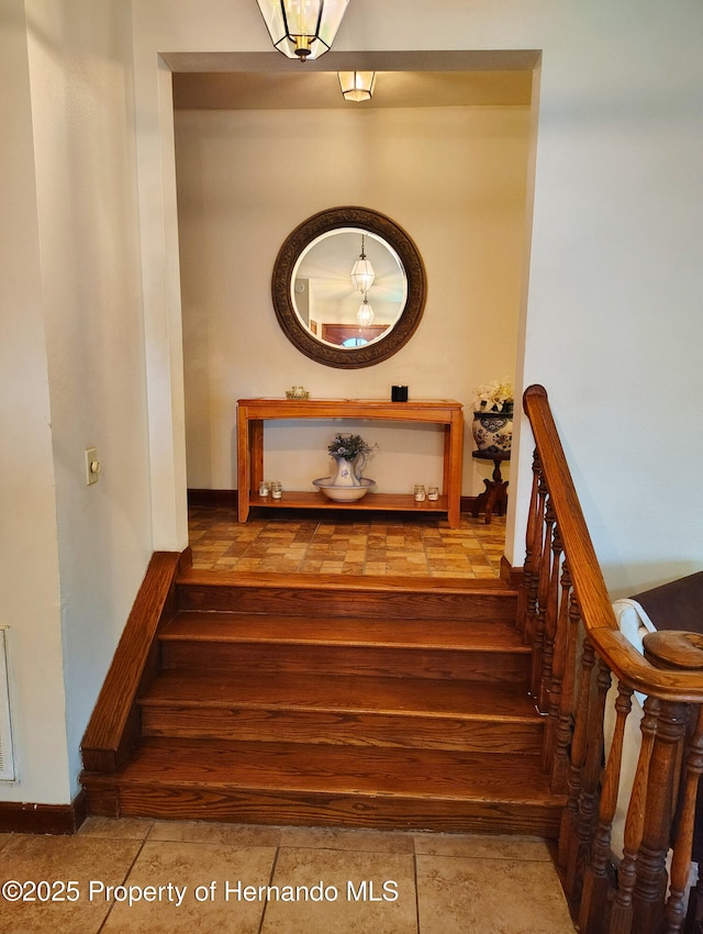 6208 Roble Ave, Spring Hill, FL 34608 - staircase with baseboards and tile patterned flooring
