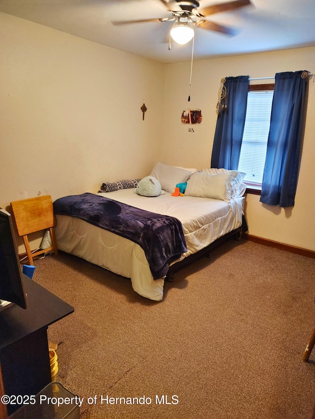 6208 Roble Ave, Spring Hill, FL 34608 - carpeted bedroom featuring baseboards and ceiling fan