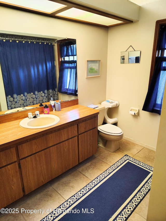 6208 Roble Ave, Spring Hill, FL 34608 - bathroom with vanity, tile patterned flooring, and a shower with shower curtain
