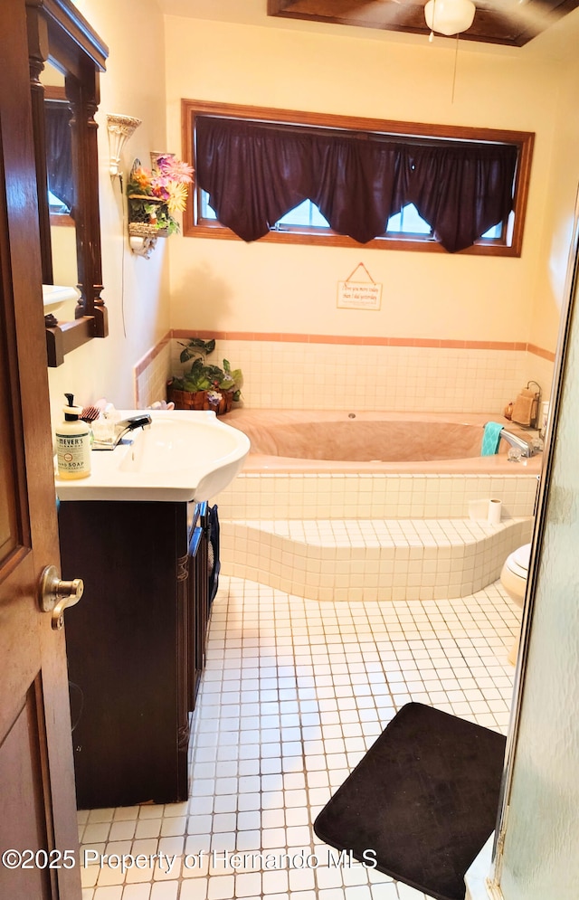 6208 Roble Ave, Spring Hill, FL 34608 - bathroom featuring tile patterned floors, a bath, and vanity