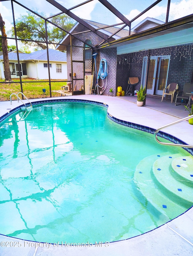 6208 Roble Ave, Spring Hill, FL 34608 - swimming pool featuring a patio and a lanai