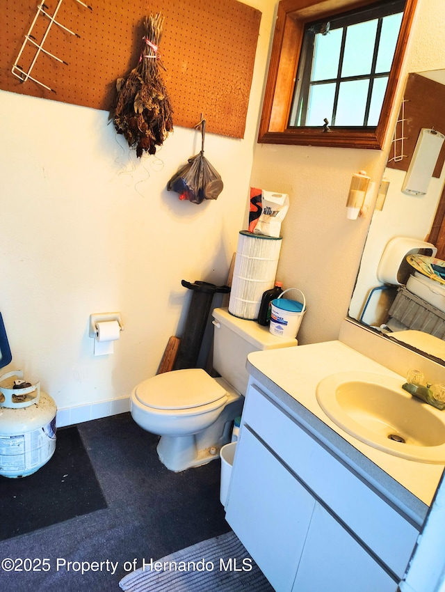 6208 Roble Ave, Spring Hill, FL 34608 - half bathroom featuring toilet and vanity