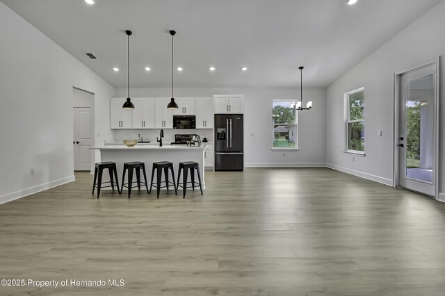 1080 Dunlap Ave, Spring Hill, FL 34609 - kitchen featuring black appliances, recessed lighting, an island with sink, white cabinetry, and baseboards