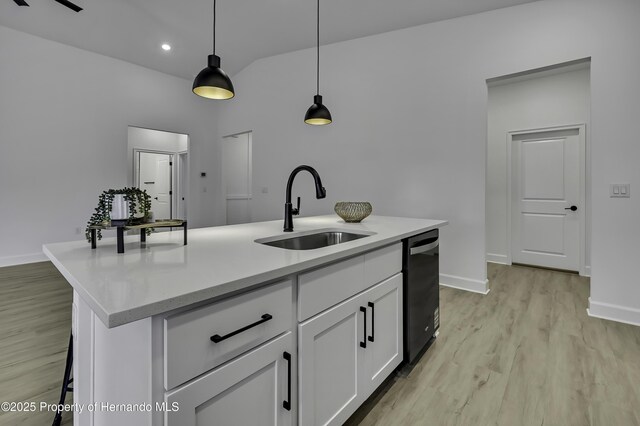 1080 Dunlap Ave, Spring Hill, FL 34609 - kitchen featuring a sink, dishwasher, decorative light fixtures, baseboards, and light wood finished floors