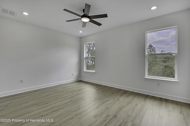 1080 Dunlap Ave, Spring Hill, FL 34609 - empty room with a ceiling fan, baseboards, recessed lighting, and wood finished floors