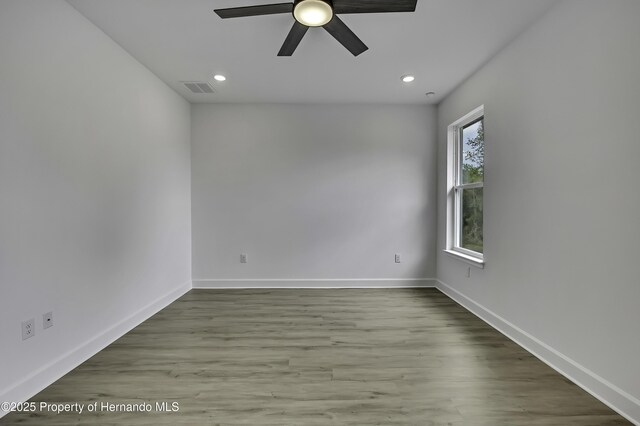 1080 Dunlap Ave, Spring Hill, FL 34609 - unfurnished room featuring ceiling fan, baseboards, wood finished floors, and recessed lighting