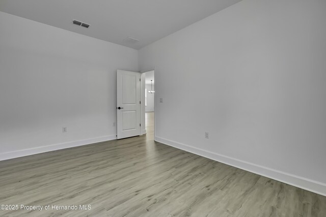 1080 Dunlap Ave, Spring Hill, FL 34609 - unfurnished room with baseboards and wood finished floors