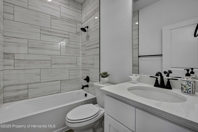 1080 Dunlap Ave, Spring Hill, FL 34609 - bathroom featuring toilet, vanity, and shower / bathtub combination