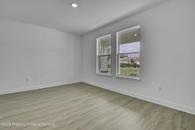 1080 Dunlap Ave, Spring Hill, FL 34609 - empty room featuring baseboards and wood finished floors