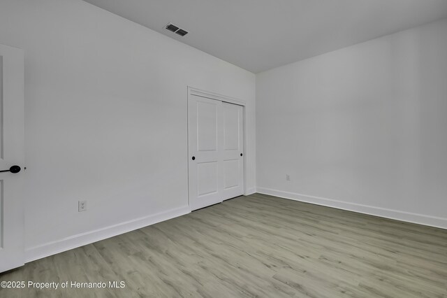 1080 Dunlap Ave, Spring Hill, FL 34609 - empty room with wood finished floors and baseboards