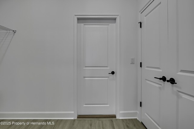 1080 Dunlap Ave, Spring Hill, FL 34609 - interior space featuring baseboards and wood finished floors