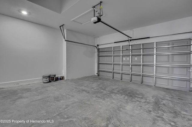 1080 Dunlap Ave, Spring Hill, FL 34609 - garage featuring a garage door opener