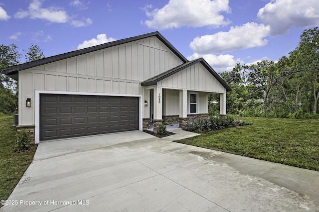 1080 Dunlap Ave, Spring Hill, FL 34609 - view of front of property featuring board and batten siding, driveway, an attached garage, and a front yard
