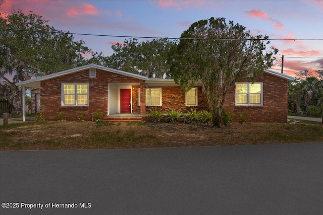 12301 Cedar St, Cedar Key, FL 32625 - ranch-style home featuring brick siding