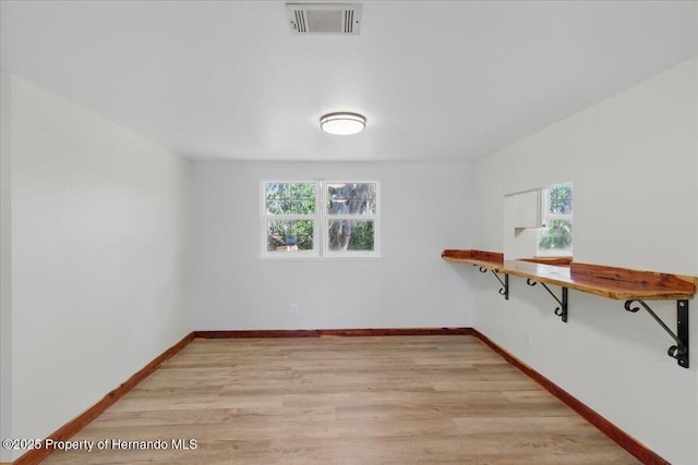 12301 Cedar St, Cedar Key, FL 32625 - empty room featuring light wood-type flooring and baseboards