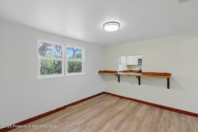 12301 Cedar St, Cedar Key, FL 32625 - unfurnished room with light wood-type flooring and baseboards