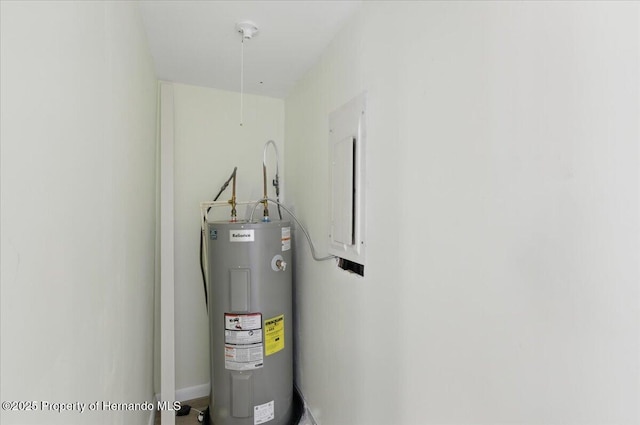 12301 Cedar St, Cedar Key, FL 32625 - utility room featuring electric water heater and electric panel