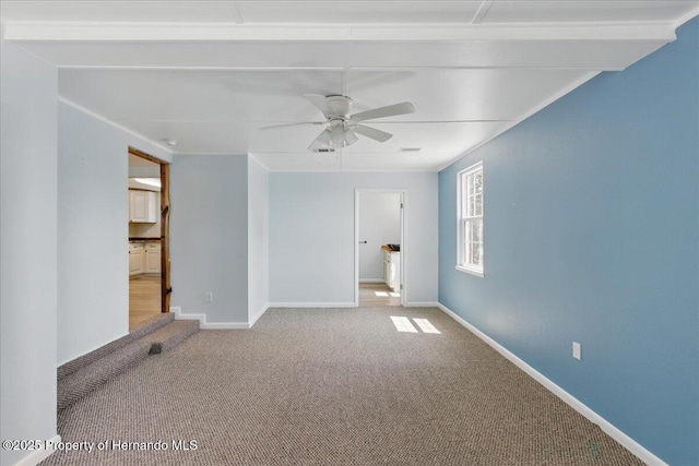 12301 Cedar St, Cedar Key, FL 32625 - empty room with carpet floors, ceiling fan, and baseboards