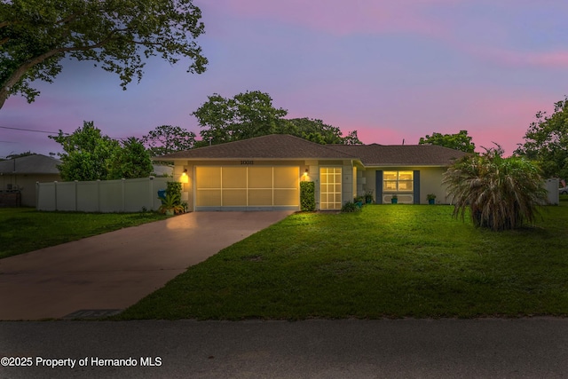1038 Shenandoah Ln, Spring Hill, FL 34606 - ranch-style house with an attached garage, concrete driveway, and stucco siding
