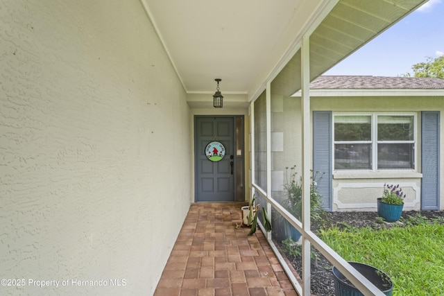 1038 Shenandoah Ln, Spring Hill, FL 34606 - view of exterior entry with stucco siding