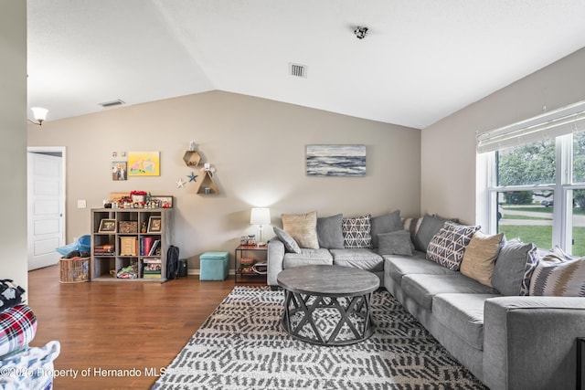 1038 Shenandoah Ln, Spring Hill, FL 34606 - living room featuring wood finished floors and lofted ceiling