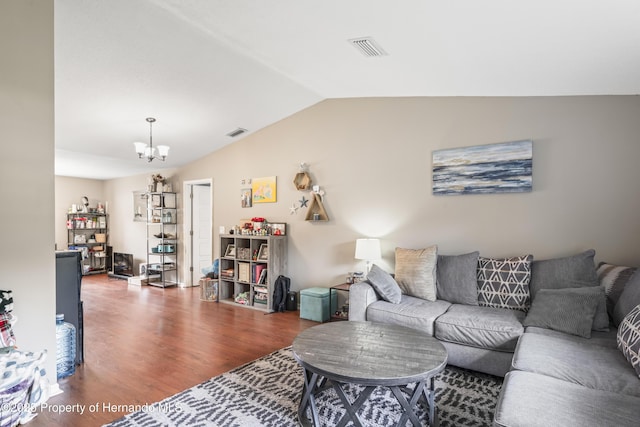 1038 Shenandoah Ln, Spring Hill, FL 34606 - living area with vaulted ceiling, wood finished floors, and a chandelier