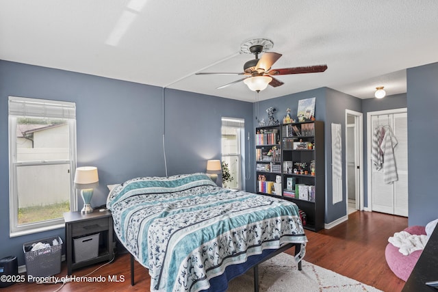 1038 Shenandoah Ln, Spring Hill, FL 34606 - bedroom with wood finished floors, baseboards, and a ceiling fan