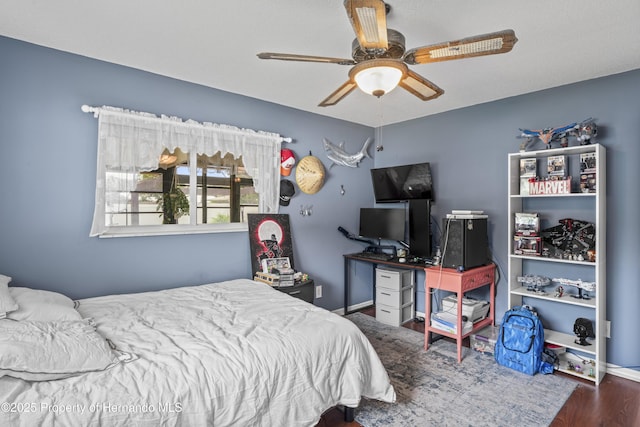 1038 Shenandoah Ln, Spring Hill, FL 34606 - bedroom featuring wood finished floors, baseboards, and a ceiling fan