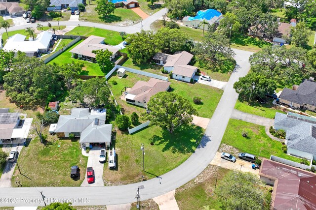1038 Shenandoah Ln, Spring Hill, FL 34606 - aerial overview of property's location featuring nearby suburban area and a pool